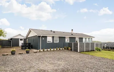 a grey house with a gravel driveway at Nice Home In Lemvig With Wifi in Lemvig
