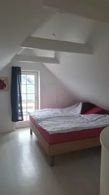 a bedroom with a bed and a window at Marku House in Struer