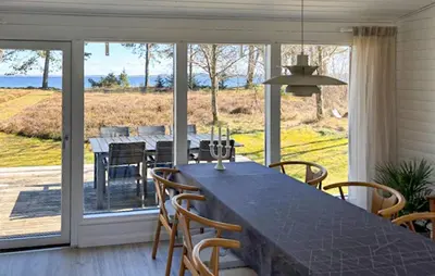 a dining room with a table and chairs at Amazing Home In Højslev With Wifi in Højslev