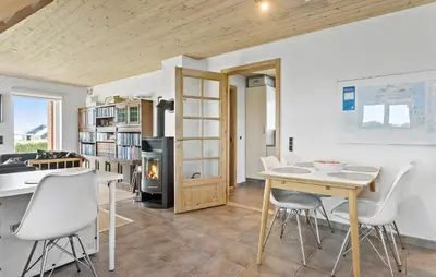 a kitchen and dining room with a table and chairs at Gorgeous Home In Øster Assels With Wifi in Øster Assels