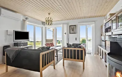 a living room with a couch and a tv at Gorgeous Home In Øster Assels With Wifi in Øster Assels