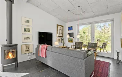 a living room with a couch and a fireplace at Stunning Home In Bedsted Thy With Wifi in Bedsted Thy