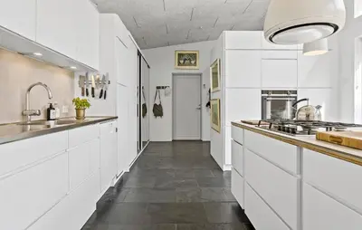 a kitchen with white cabinets and a long hallway at Stunning Home In Bedsted Thy With Wifi in Bedsted Thy