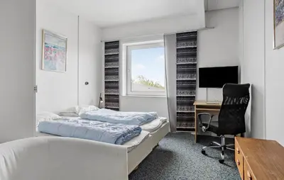 a bedroom with two beds and a desk and a computer at 11 Bedroom Gorgeous Home In Hurup Thy in Hurup