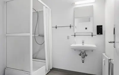 a white bathroom with a sink and a shower at 11 Bedroom Gorgeous Home In Hurup Thy in Hurup