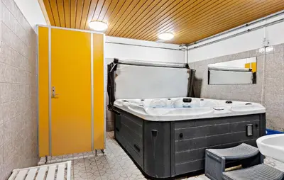 a bathroom with a tub and a sink at 11 Bedroom Gorgeous Home In Hurup Thy in Hurup