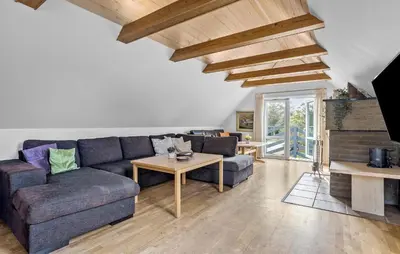 a living room with a couch and a table at Stunning Home In Vestervig With Sauna in Vestervig