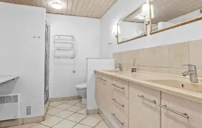 a bathroom with a sink and a toilet at Stunning Home In Vestervig With Sauna in Vestervig