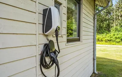 a television on the side of a house at Awesome Home In Vemb With Kitchen in Vemb