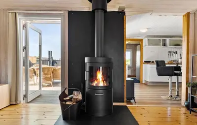 a fireplace in the living room of a house at Lovely Home In Thisted With Kitchen in Thisted