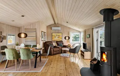a living room with a fireplace and a couch at Lovely Home In Thisted With Kitchen in Thisted