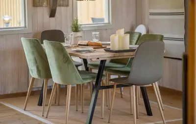a dining room table with green chairs in a kitchen at Lovely Home In Thisted With Kitchen in Thisted