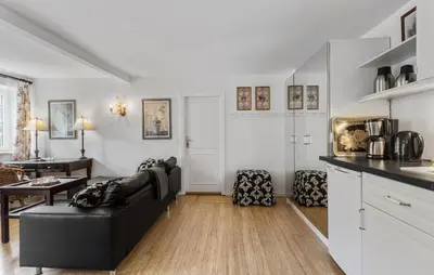 a living room with a couch and a table at Lejl 5 in Brovst