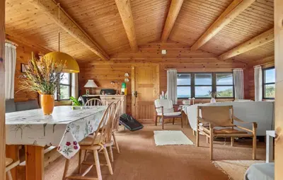 a kitchen and dining room with a table and chairs at 2 Bedroom Lovely Home In Saltum in Saltum