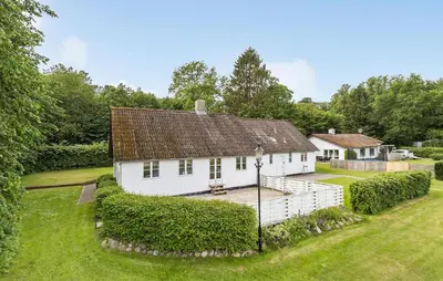 an image of a white house with a yard at Hus 1 in Brovst