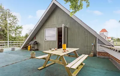 a picnic table in front of a house at Lovely Apartment In Erslev With Wifi in Erslev