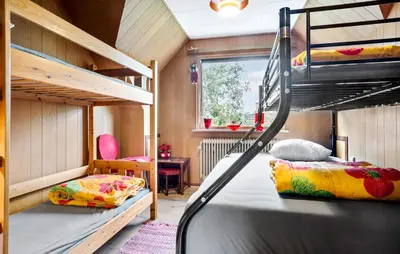 a room with two bunk beds and a desk at Lovely Apartment In Erslev With Wifi in Erslev