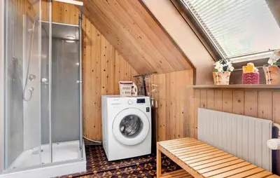 a bathroom with a washing machine and a window at Lovely Apartment In Erslev With Wifi in Erslev