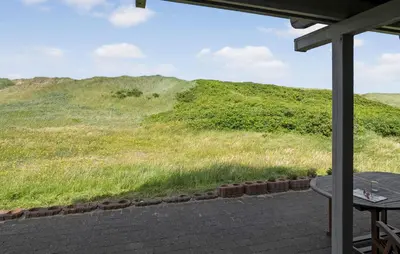 a view of a grassy hill from a patio at Cozy Home In Harboøre With Wifi in Harboør