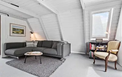 a living room with a couch and a chair at Nice Home In Farsø With Kitchen in Farsø