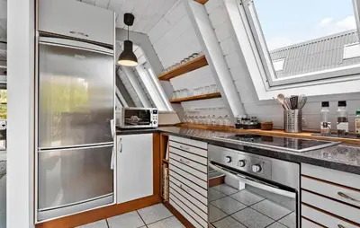 a kitchen with a sink and a stove at Nice Home In Farsø With Kitchen in Farsø