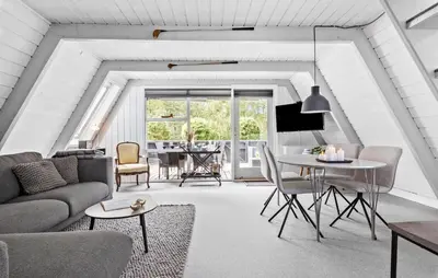 a living room with a couch and a table at Nice Home In Farsø With Kitchen in Farsø