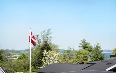 a flag flying on top of a house at 3 Bedroom Stunning Home In Løgstrup in Løgstrup