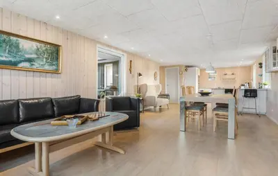 a living room with a couch and a table at Awesome Home In Løgstør With Wifi in Løgstør