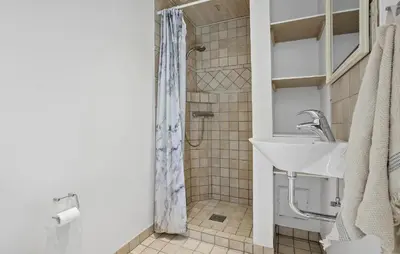 a bathroom with a sink and a shower at 3 Bedroom Beautiful Home In Roslev in Roslev
