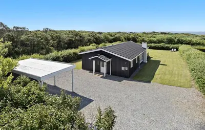 a small house with a solarium and a picnic table at Lovely Home In Vestervig With Kitchen in Vestervig