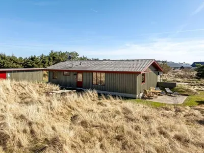 a house sitting on top of a field at Holiday Home Frandsine - 1-2km from the sea by Interhome in Thisted