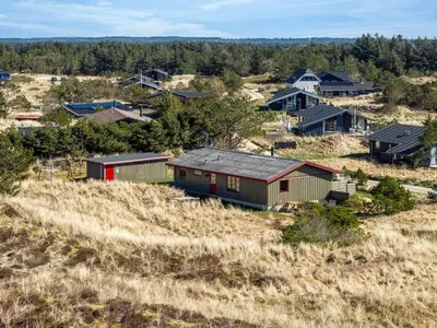 a group of houses on a hill in a field at Holiday Home Frandsine - 1-2km from the sea by Interhome in Thisted