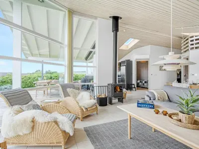 a living room with a couch and a table at Holiday Home Gedda - from the sea by Interhome in Vestervig