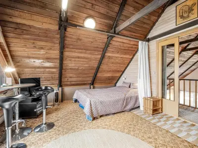 a bedroom with a bed and a desk in a room at Holiday Home Luzy - 75m from the sea by Interhome in Harboør