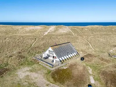 an aerial view of a house in a field at Holiday Home Luzy - 75m from the sea by Interhome in Harboør