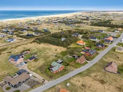 an aerial view of a house next to the beach at Holiday Home Hilppa - 400m from the sea by Interhome in Harboør