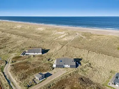 an aerial view of a house and the beach at Holiday Home Kurt - 75m from the sea by Interhome in Harboør