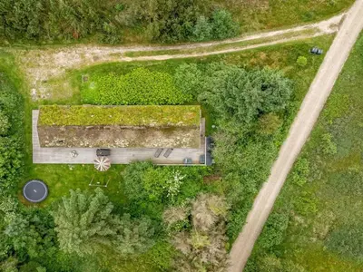 an overhead view of a building in the middle of a forest at Holiday Home Yngve - 1-2km from the sea by Interhome in Løkken