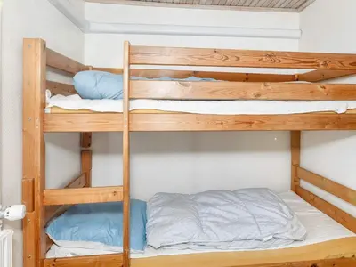a bunk bed room with two bunk beds at Scenic Pool House Retreat - By Traum Ferienwohnungen in Thyholm