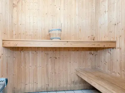 a wooden shelf in a sauna with a cup on it at 4 star holiday home in Harboøre in Harboør