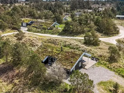 an overhead view of a house with a grass roof at Holiday Home Annlisa - 1km from the sea by Interhome in Blokhus