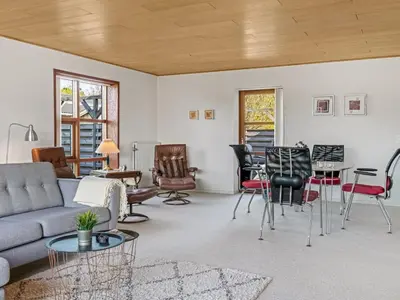 a living room with a couch and chairs at Holiday Home Satu - 2km from the sea by Interhome in Blokhus