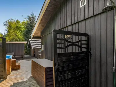 a black gate on the side of a building at Holiday Home Hermand - 3-5km from the sea by Interhome in Brovst