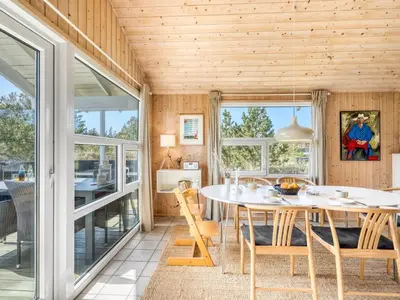 a dining room with a table and chairs at Holiday Home Elisenda - 1km from the sea by Interhome in Torsted