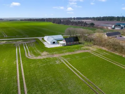 an aerial view of a farm with a house at Holiday Home Kerrin - 1km from the sea by Interhome in Hanstholm