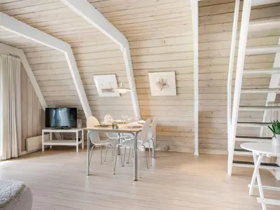 a dining room with a table and chairs at Holiday Home Erly - 18km to the fjord by Interhome in Farsø