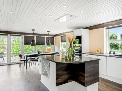a kitchen with a large island in the middle at Holiday Home Skip - 300m to the fjord by Interhome in Højslev