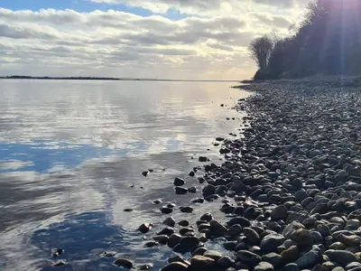 a group of rocks on the shore of a body of water at 8 person holiday home in Hurup Thy-By Traum in Sindrup