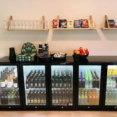 a refrigerator filled with different types of drinks at Skovly in Viborg