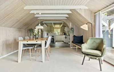 a kitchen and dining room with a table and chairs at 2 Bedroom Beautiful Home In Farsø in Farsø